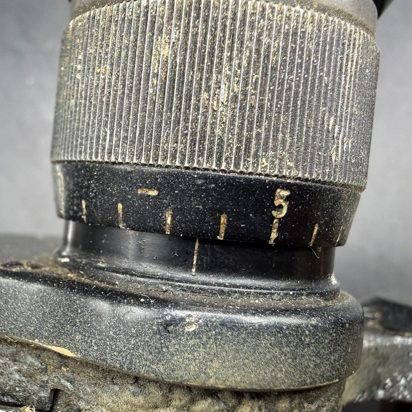 Close-up of diopter adjustment ring on WWII German Dienstglas 6×30 binoculars, with clearly visible original scale markings.