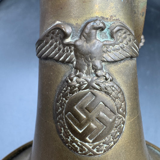 Close-up of original SA eagle with swastika emblem on German SA bugle