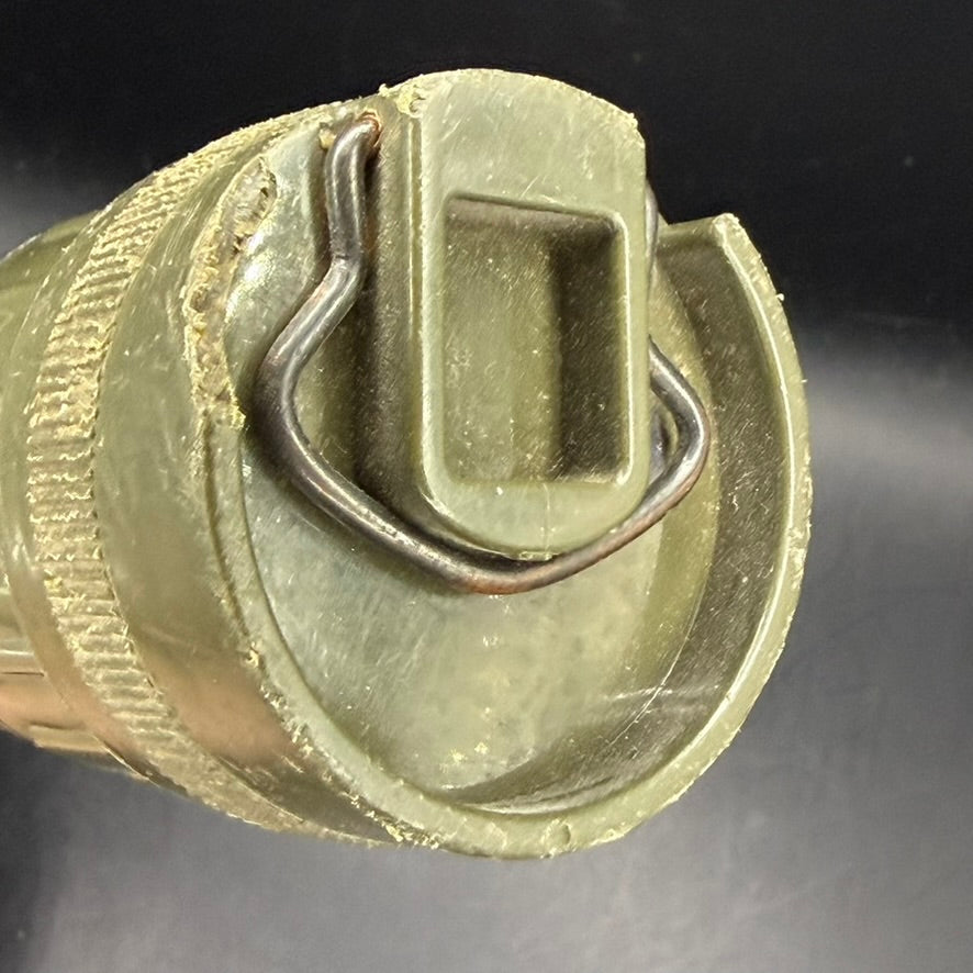 Detail of metal clip on WWII U.S.N. flashlight