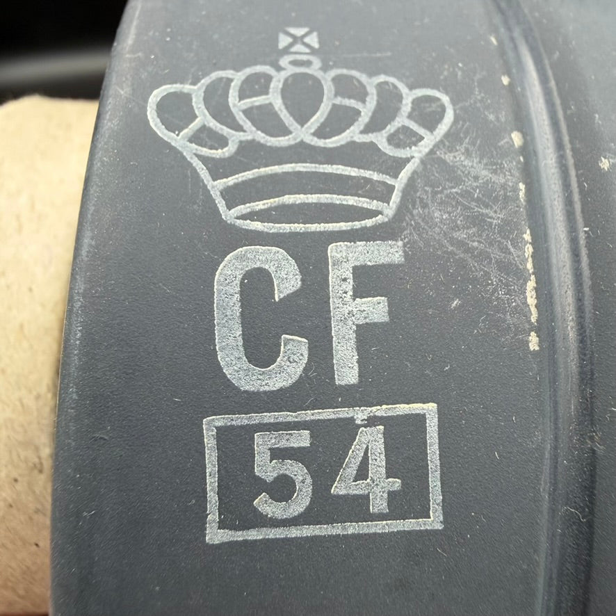 Close-up of British gas mask filter showing crown CF marking