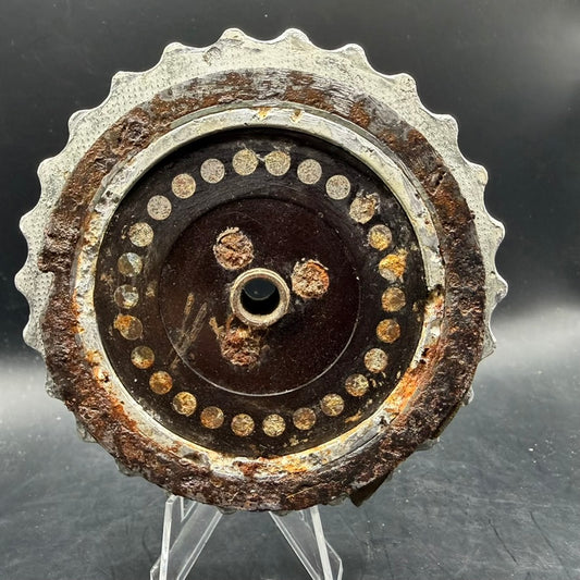 Front view of Enigma machine rotor showing contact points and corrosion