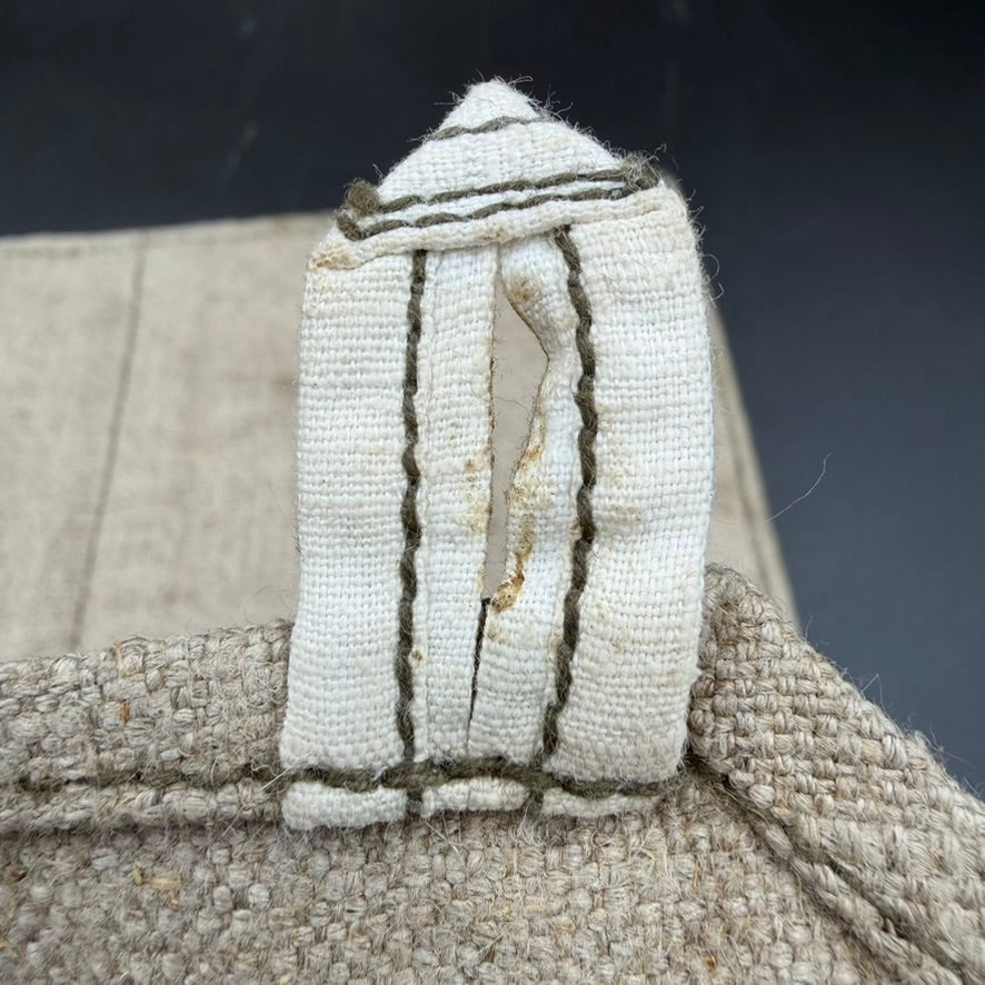 Close-up of canvas closure strap on original WWII Soviet PPSh-41 ammunition pouch