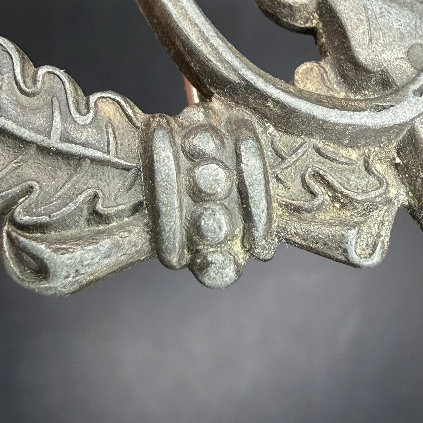 Oak-leaf wreath detail showing sharp relief and hollow construction