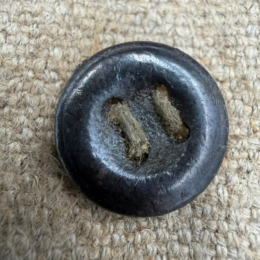 Detail of original metal button on WWII Soviet PPSh-41 ammo pouch