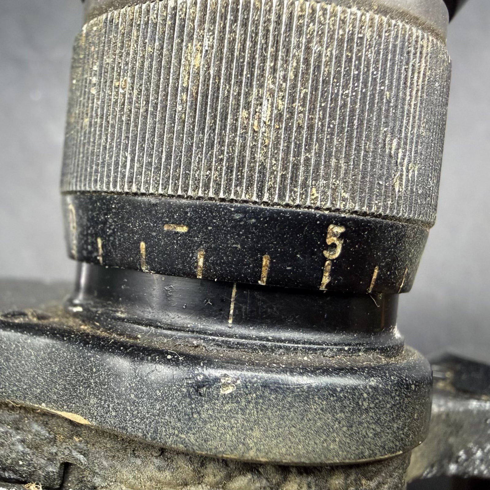 Close-up of diopter adjustment ring on WWII German Dienstglas 6×30 binoculars, with clearly visible original scale markings.