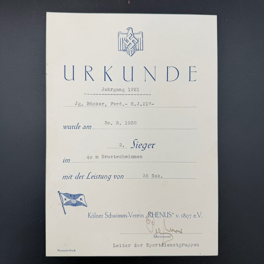 1938 swimming competition certificate showing second place result and performance time