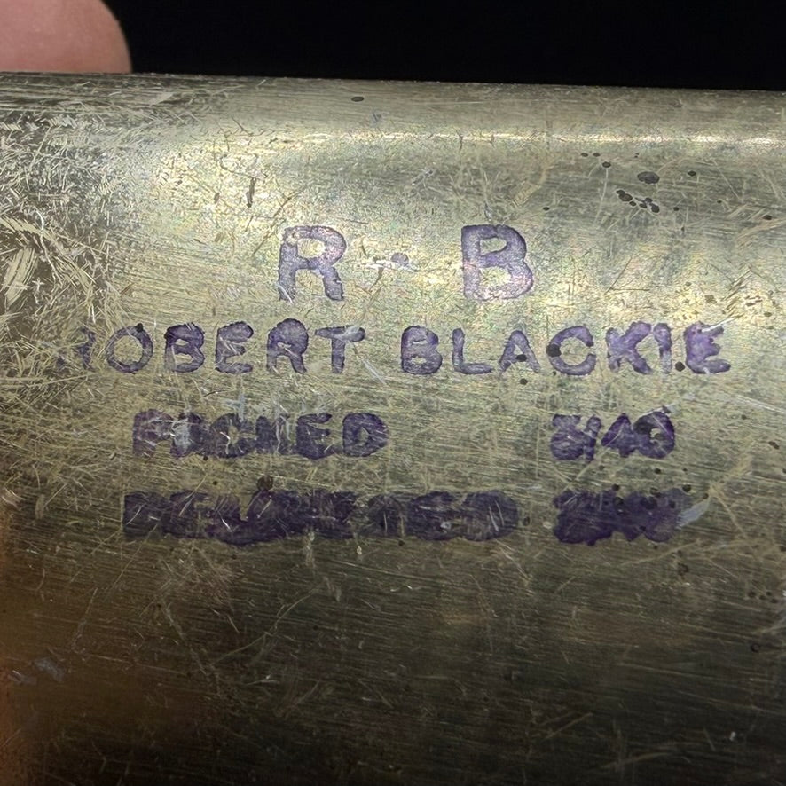 Close-up of service markings and March 1940 date on foot powder tin