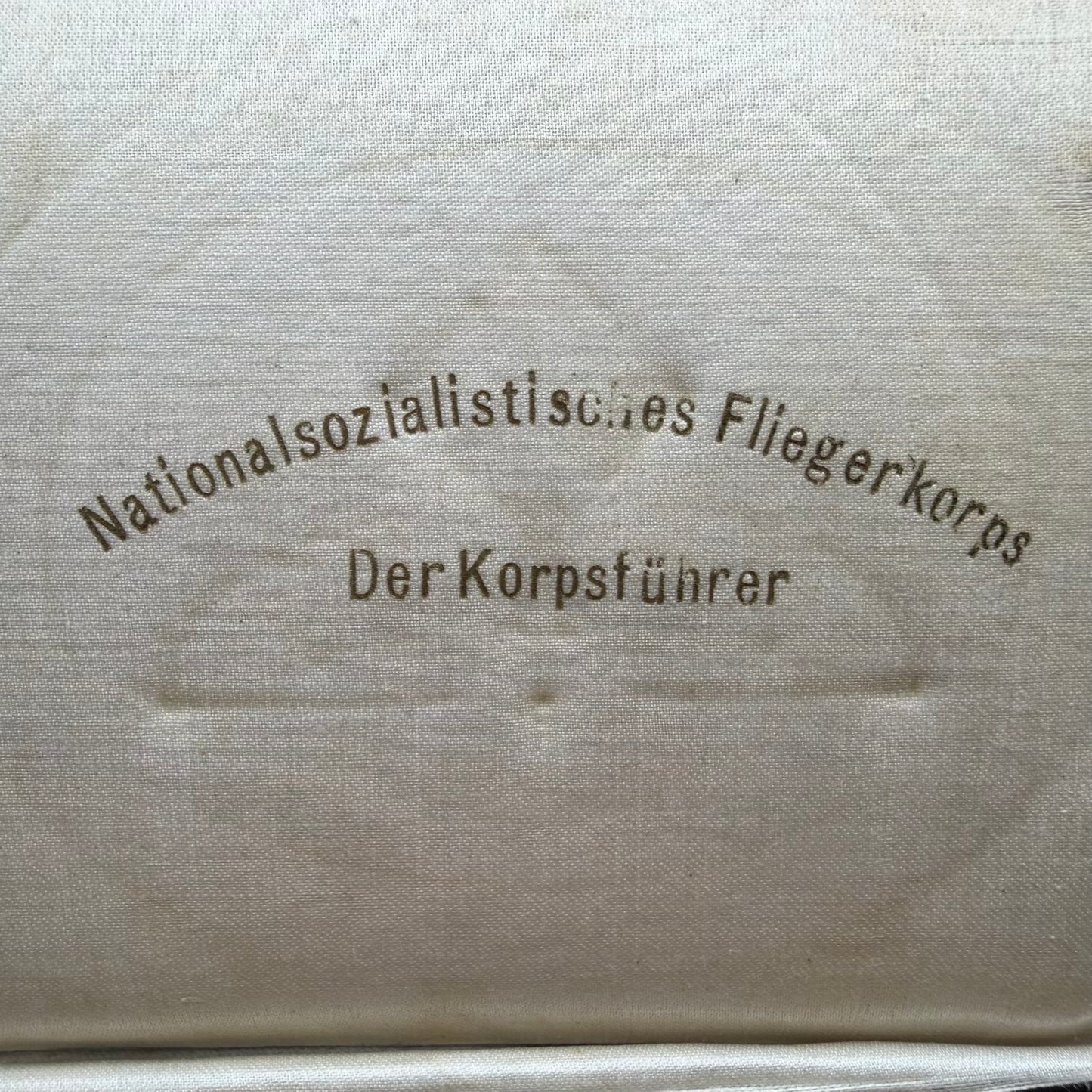 Printed inner lid of NSFK presentation case marked Der Korpsführer
