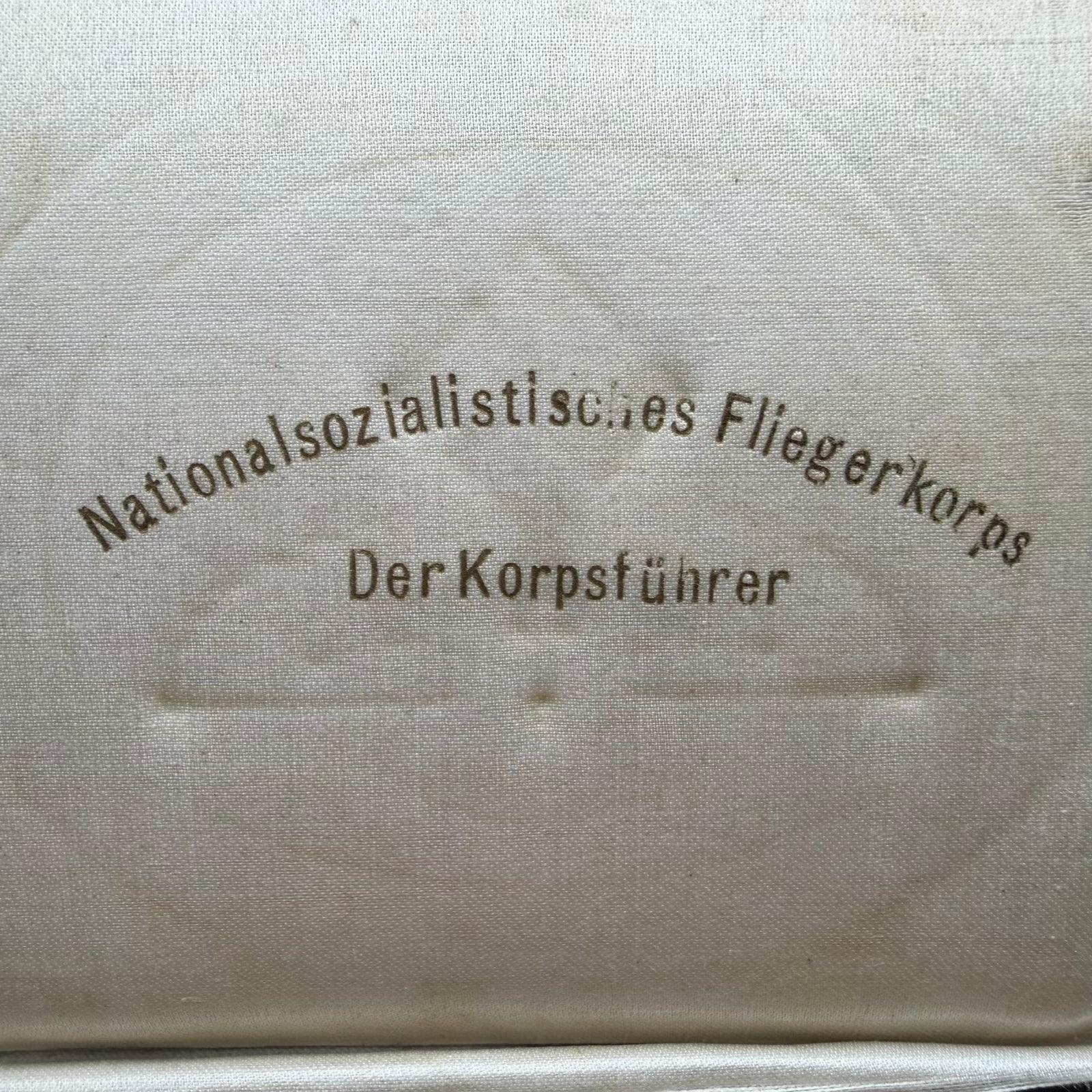 Printed inner lid of NSFK presentation case marked Der Korpsführer