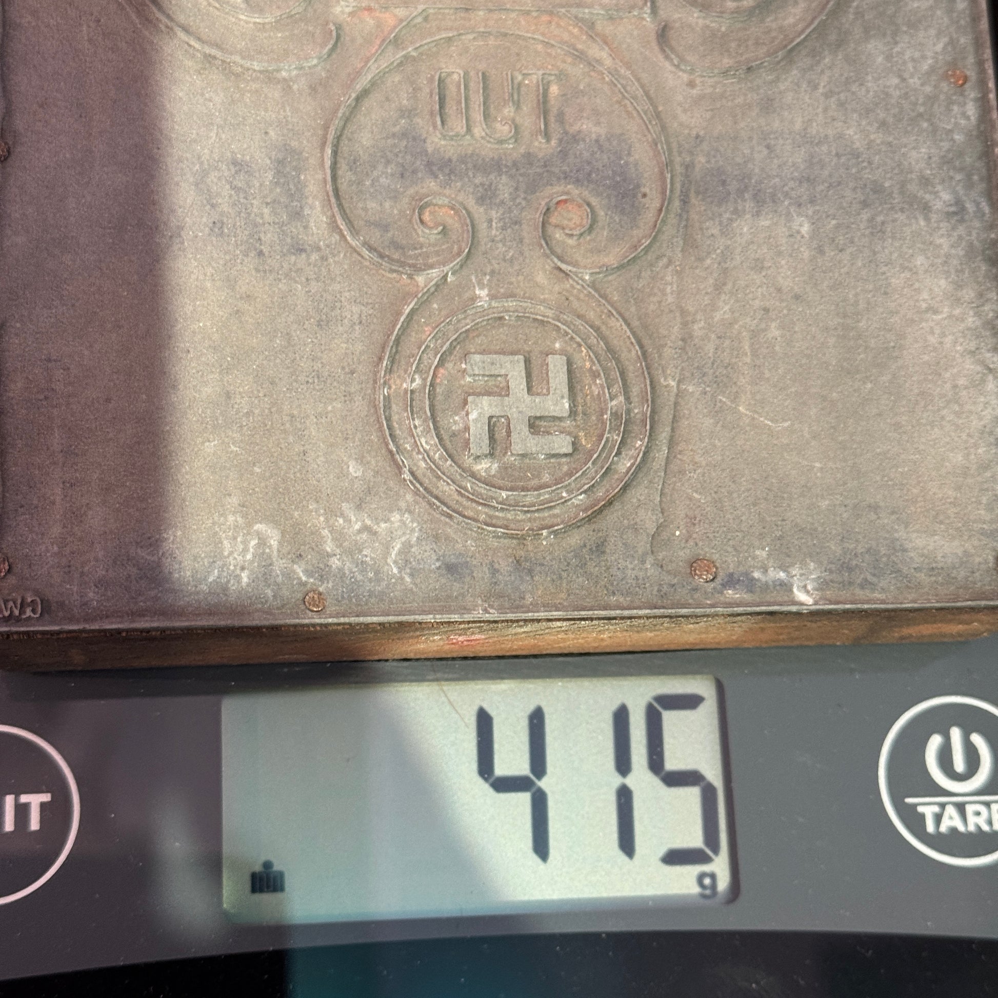 Weight detail of WWII period propaganda printing plate, approximately 4.15 kg, solid metal and wood construction