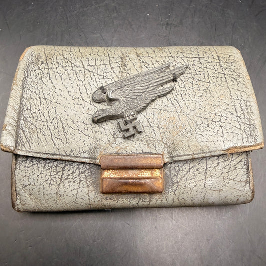 WW2 original artifact – WWII-era leather wallet, featuring a metal Fallschirmjäger-style eagle badge – AxisArtifacts