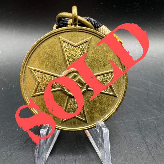 WW2 original artifact – Kriegsverdienst Medal with original ribbon – AxisArtifacts