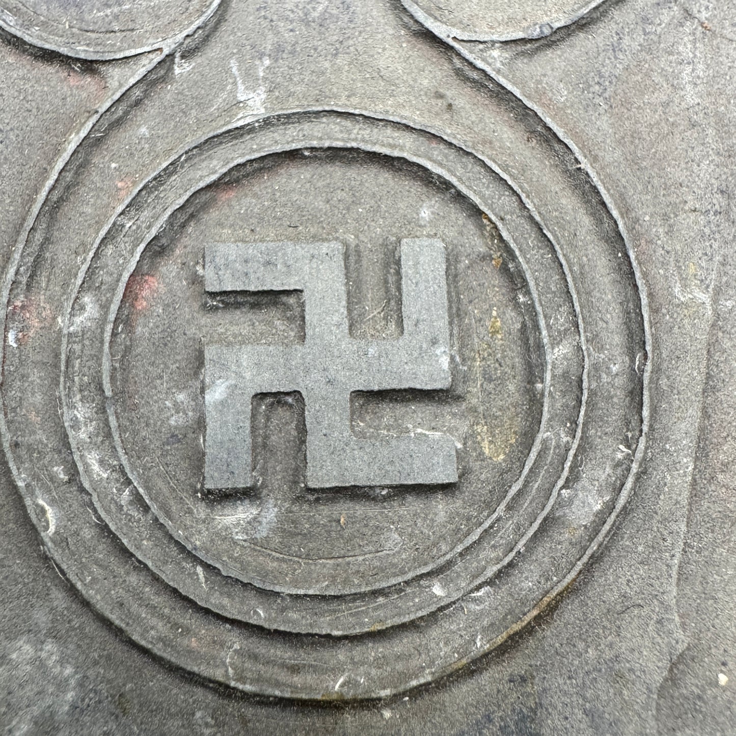 Close-up of swastika emblem on WWII National Socialist propaganda printing plate