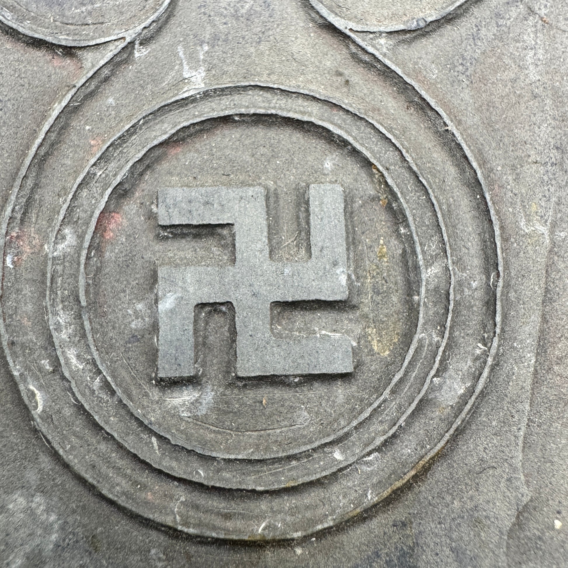 Close-up of swastika emblem on WWII National Socialist propaganda printing plate