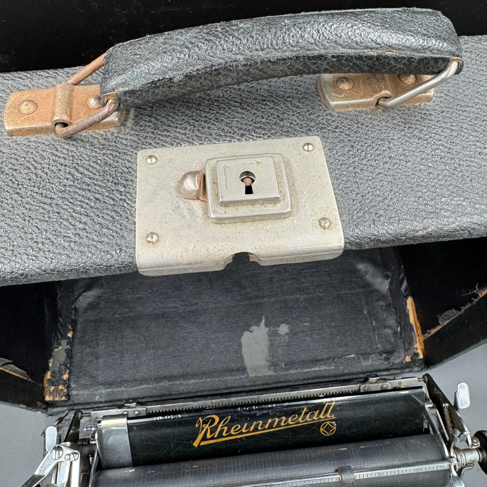 Lock and closure detail of original WWII Rheinmetall typewriter carrying case
