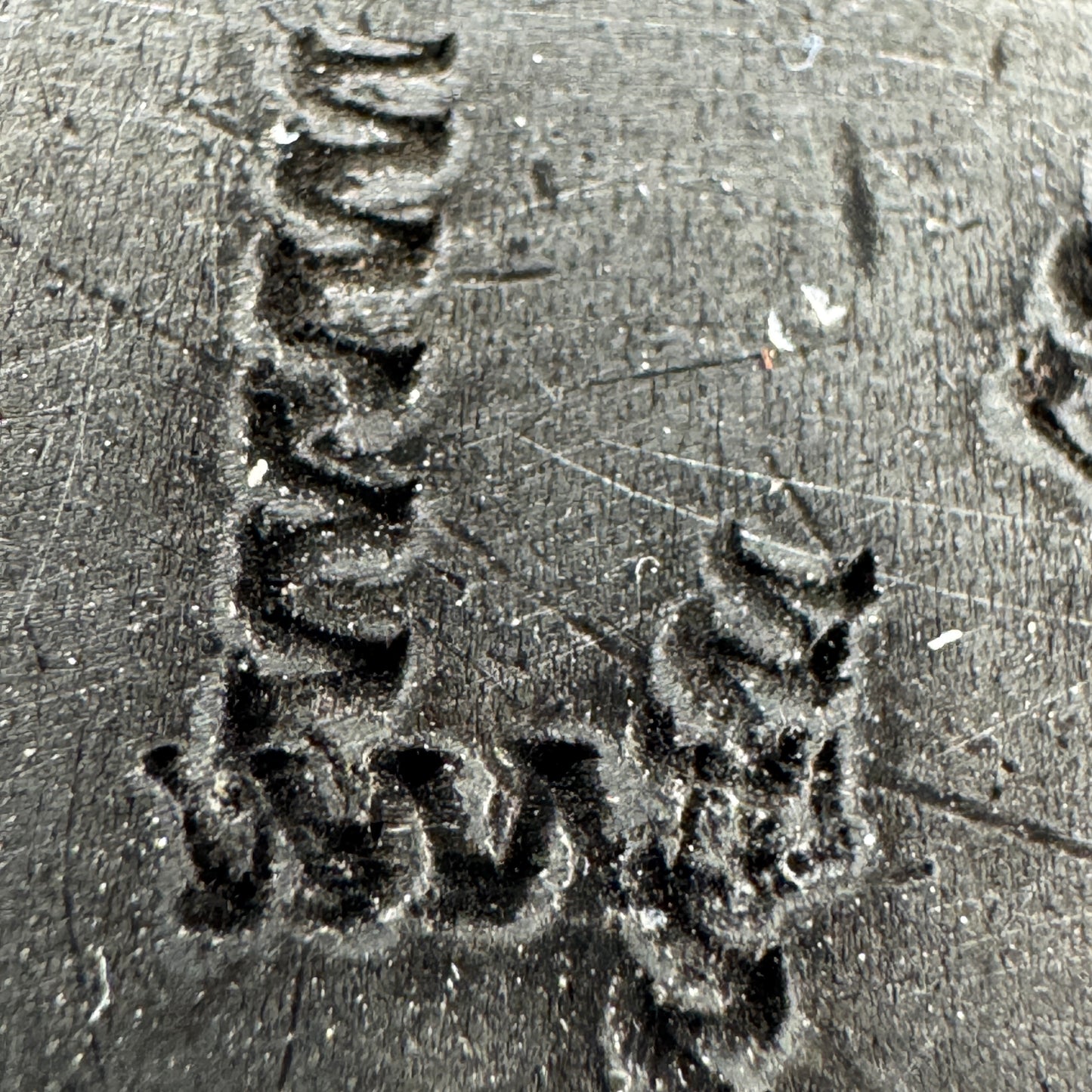 Close-up of additional hand-carved markings on WWII German canteen trench art