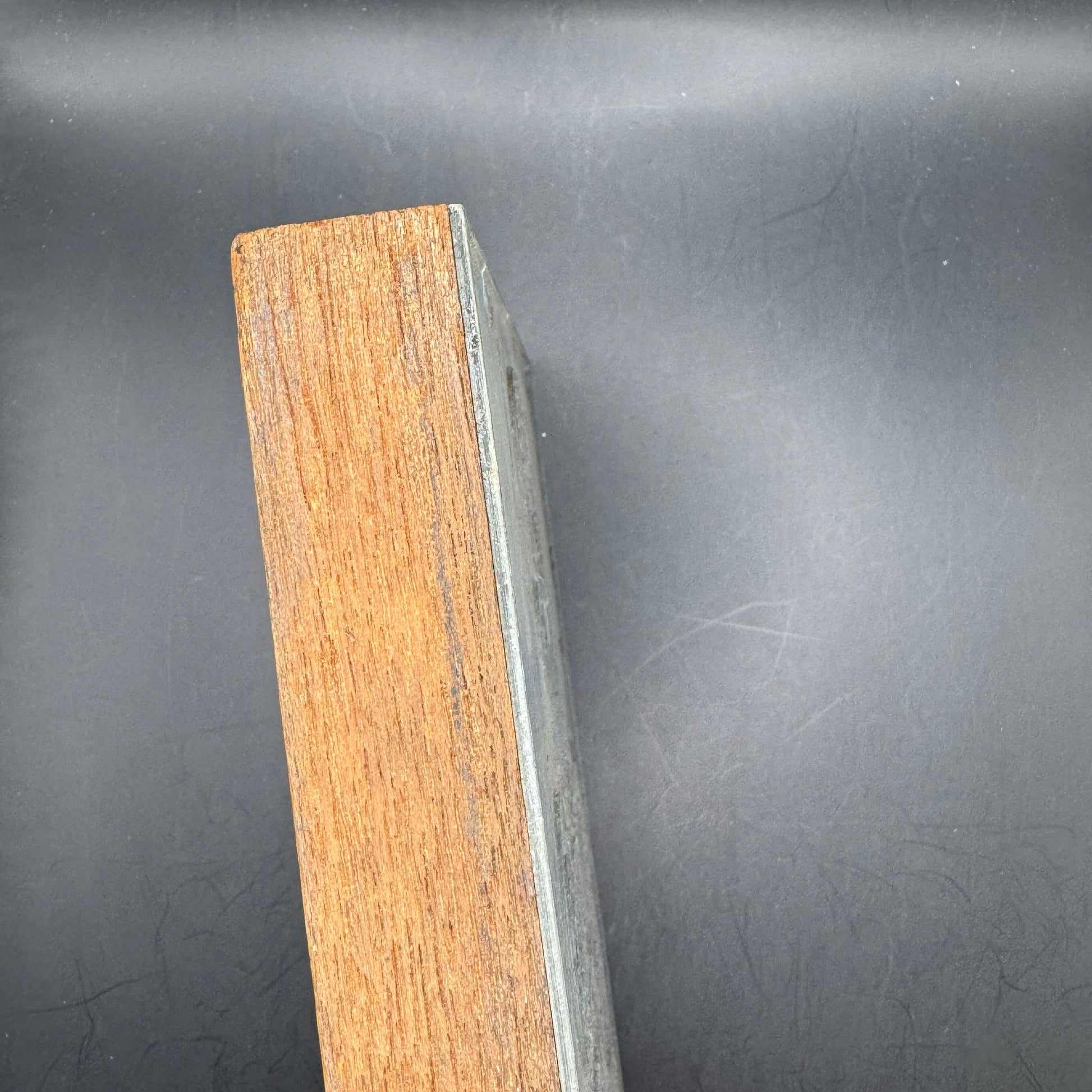 Side profile of wooden mounting block of WWII propaganda printing plate