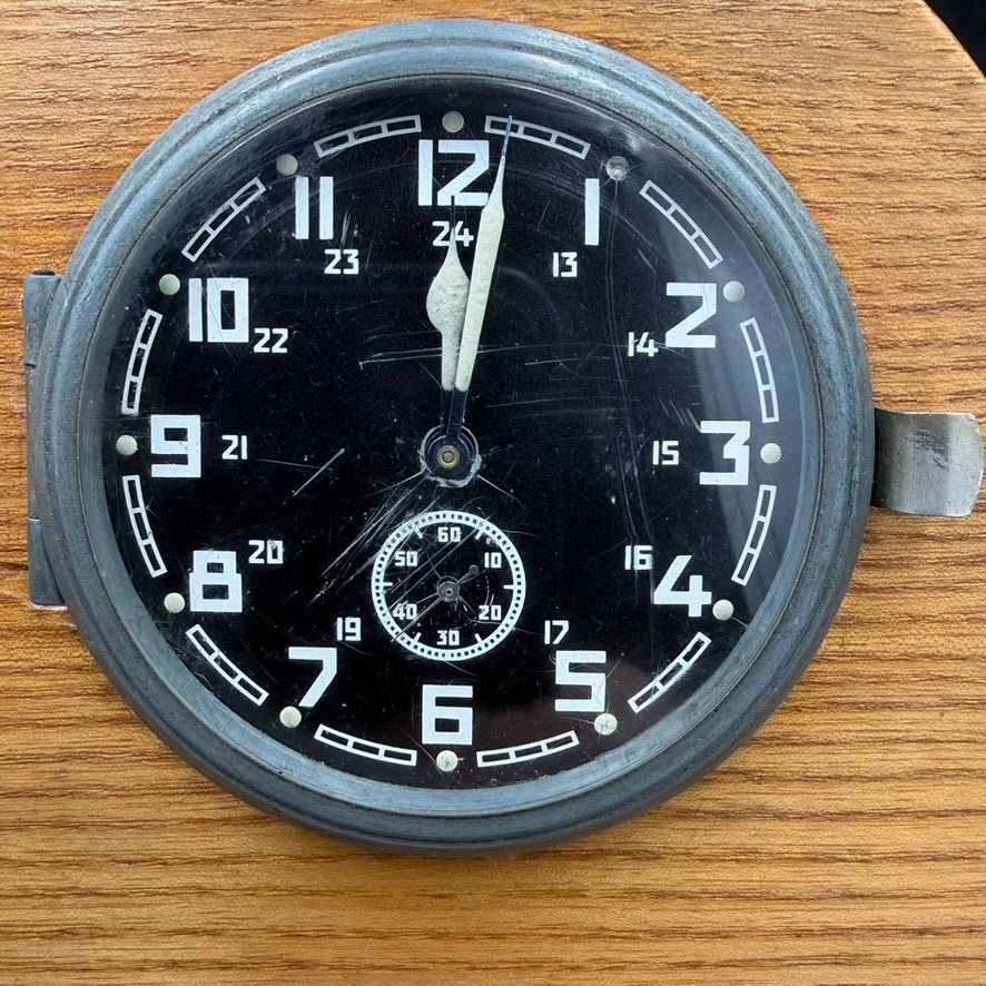 Close-up of Kienzle clock dial showing luminous hands and sub-seconds register