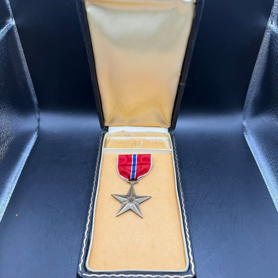 Open WWII Bronze Star Medal presentation case with medal inside