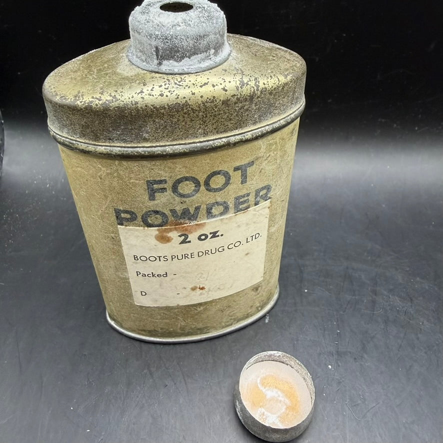 Angled view of WWII British foot powder tin with shaker lid