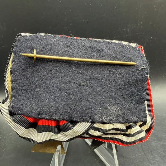 Reverse of WWI German medal bar showing felt backing and long brass pin