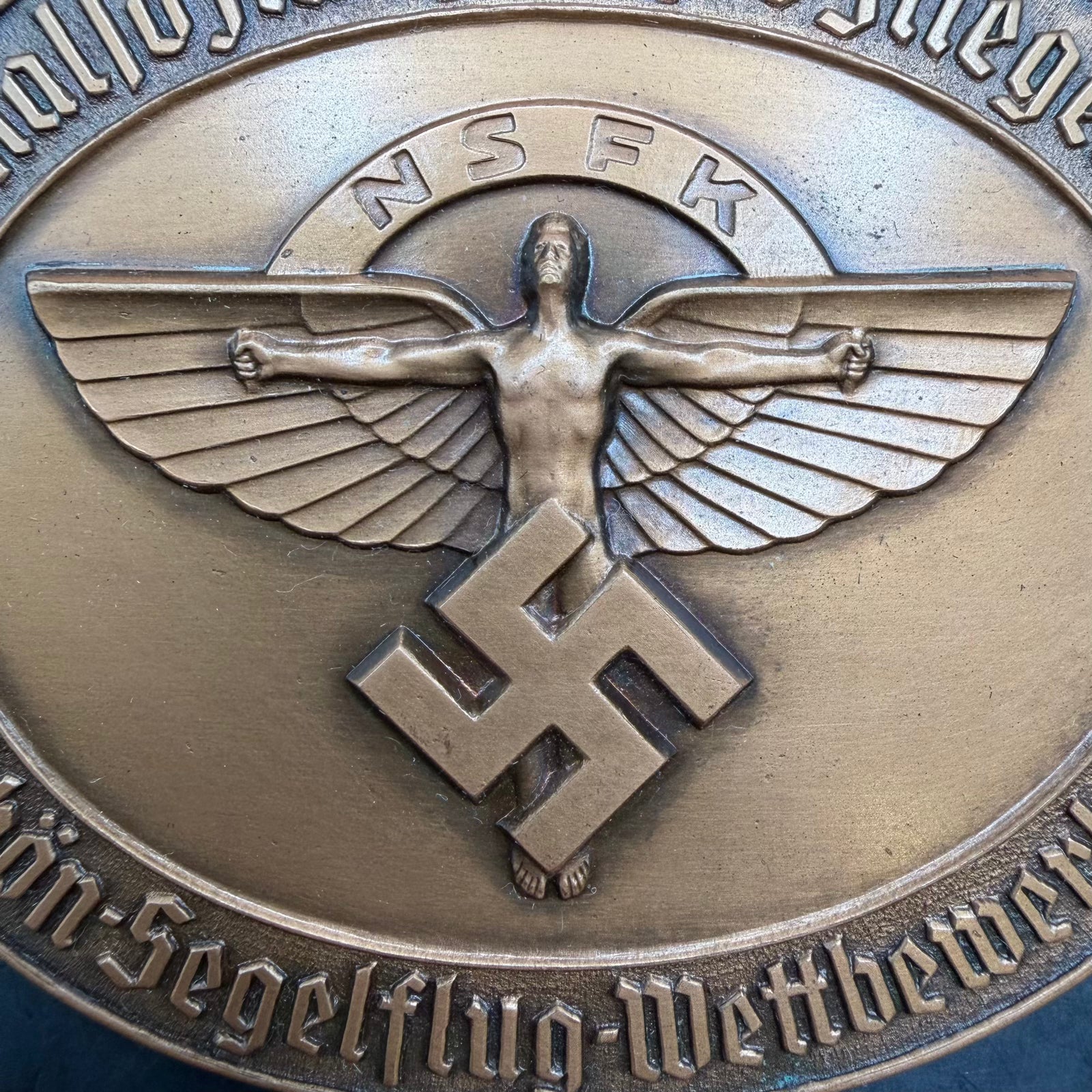 Close-up of NSFK winged figure emblem on 1938 bronze gliding medal