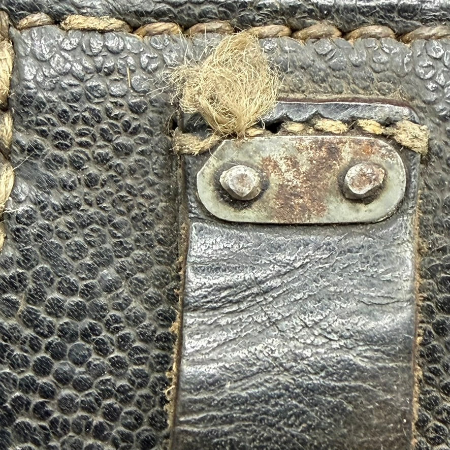 Close-up of original stitching and leather texture on K98 ammo pouch