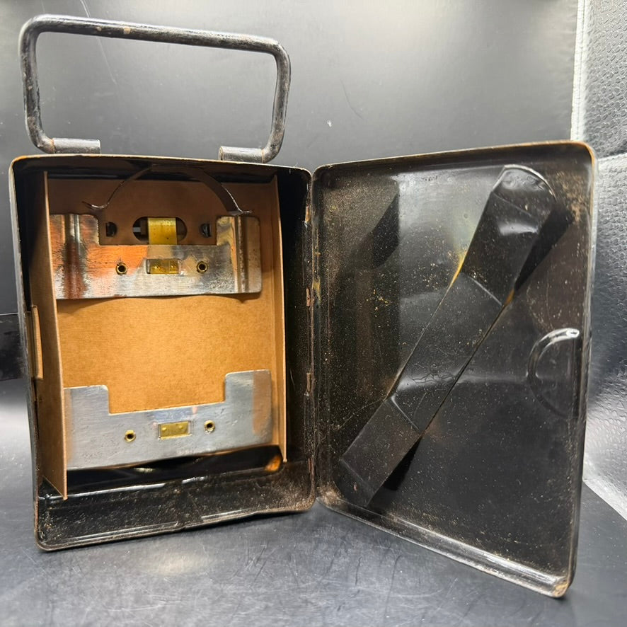 Interior view of WWII German service hand lamp showing original battery compartment