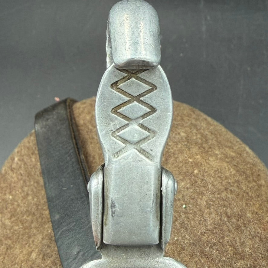 Close-up of aluminium cup clip hinge with Ritter Aluminium D.R.G.M. marking