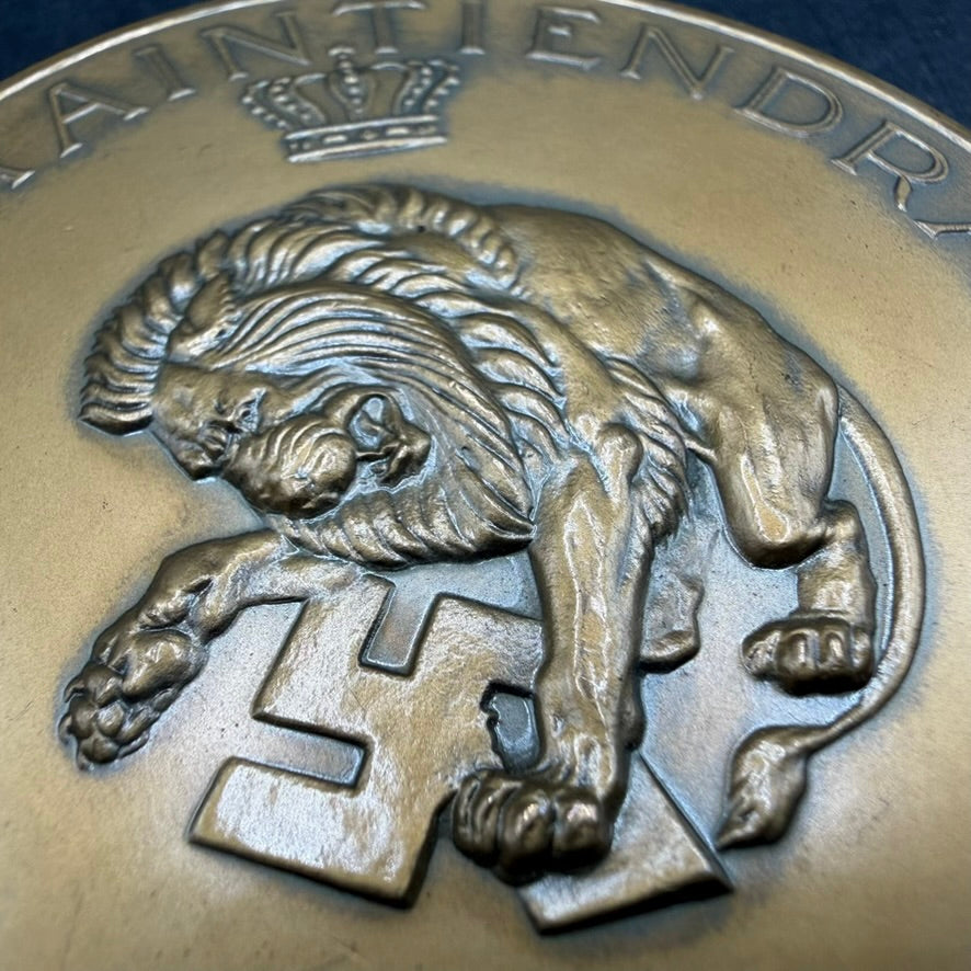 Close-up Dutch lion over swastika “Je Maintiendrai” Netherlands liberation medal detail bronze relief