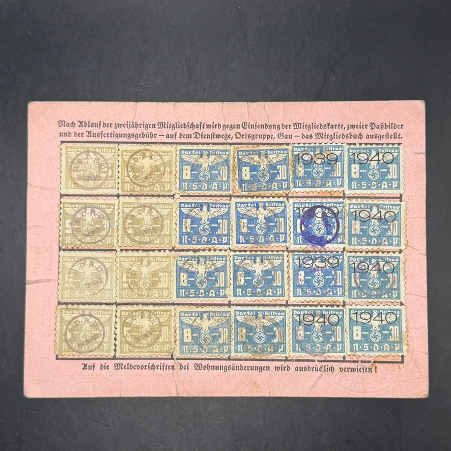 Reverse of WWII NSDAP membership card showing multiple original party contribution stamps