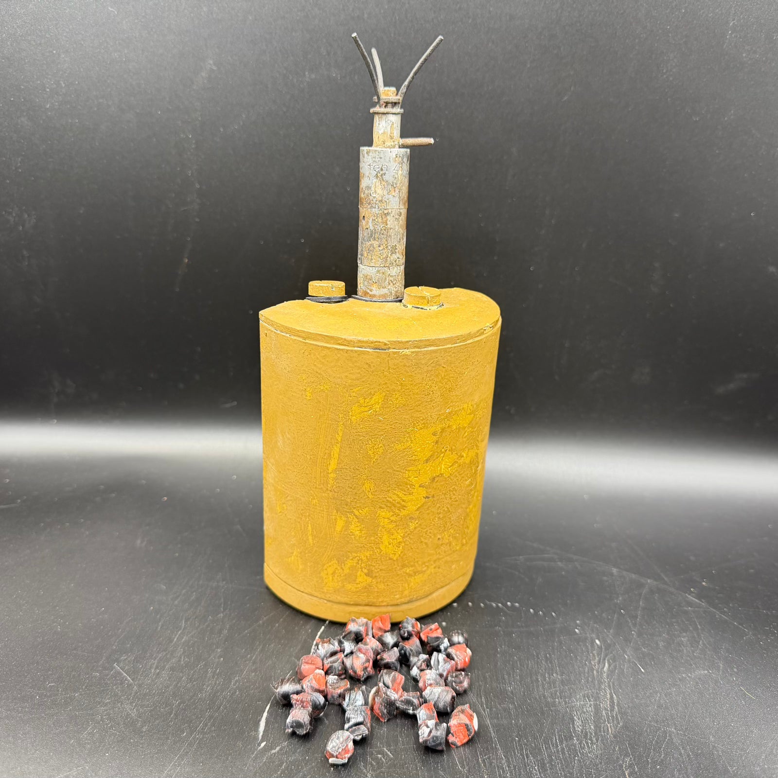 Original WWII German S-mine exterior with yellow painted steel body, deactivated