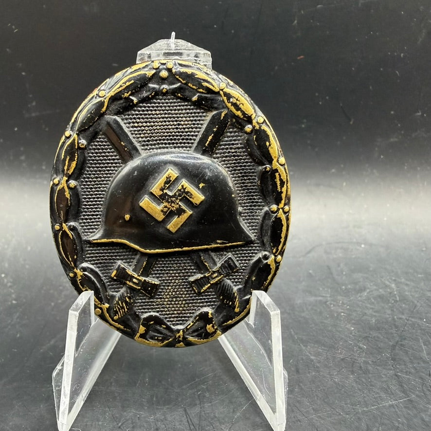 WWII German Wound Badge in Black, unmarked brass example with helmet and crossed swords