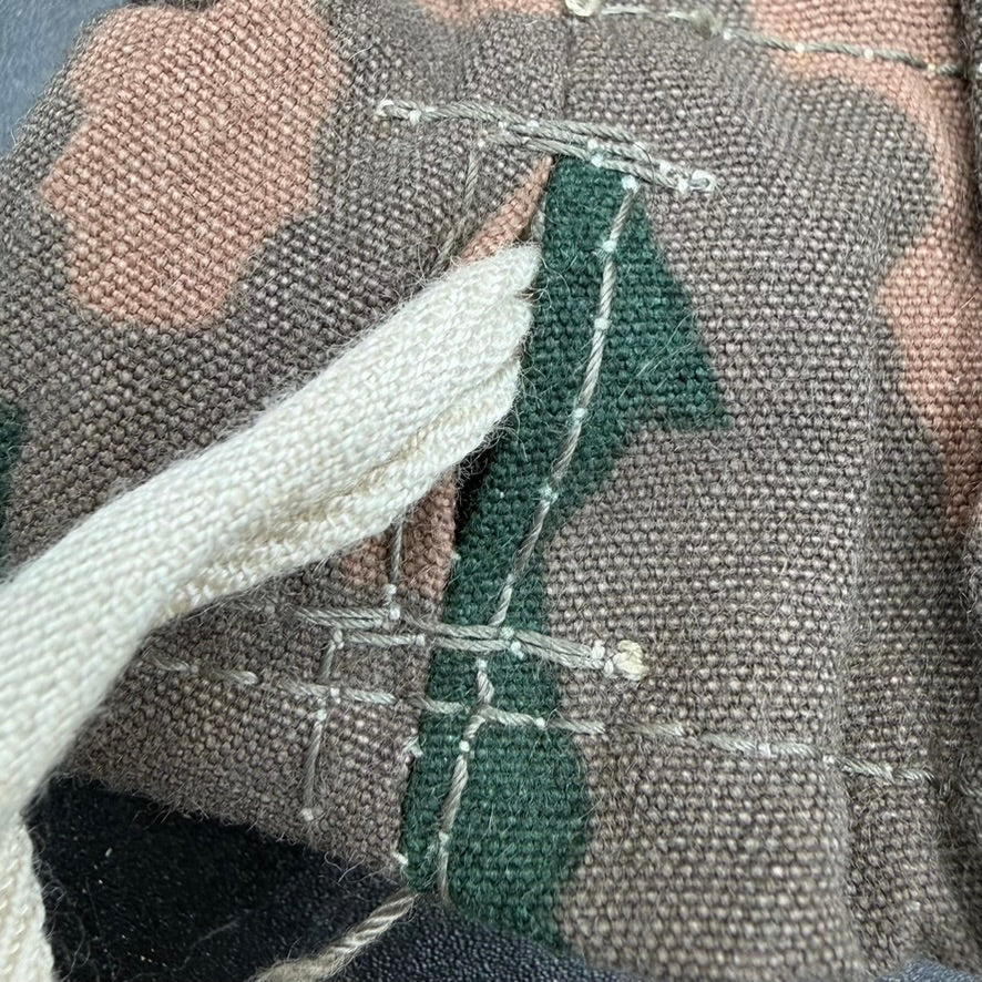 Close-up of period stitching and fabric weave on SS winter mittens