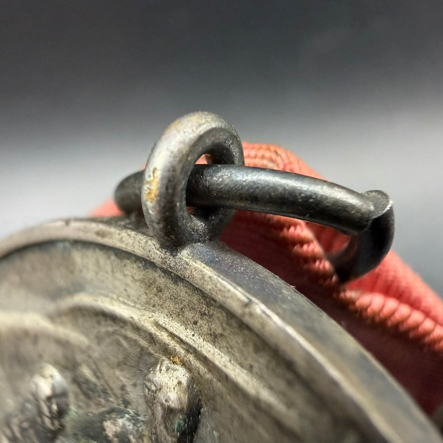 Detail of original ribbon and suspension bar on Anschluss Medal