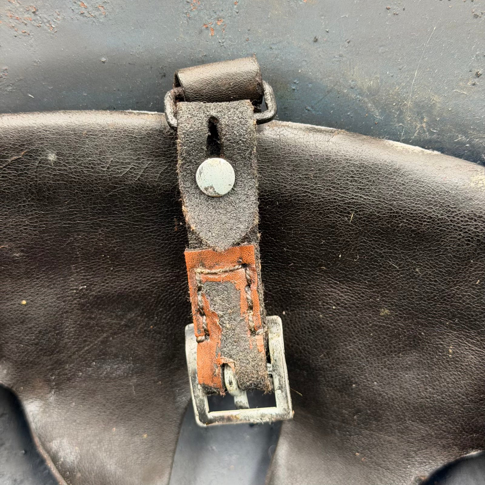 Detail of original chinstrap and buckle on WWII Luftschutz helmet