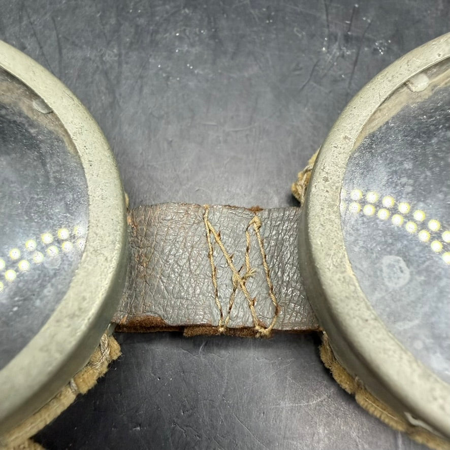 Detail of leather nose bridge stitching on British WWII goggles