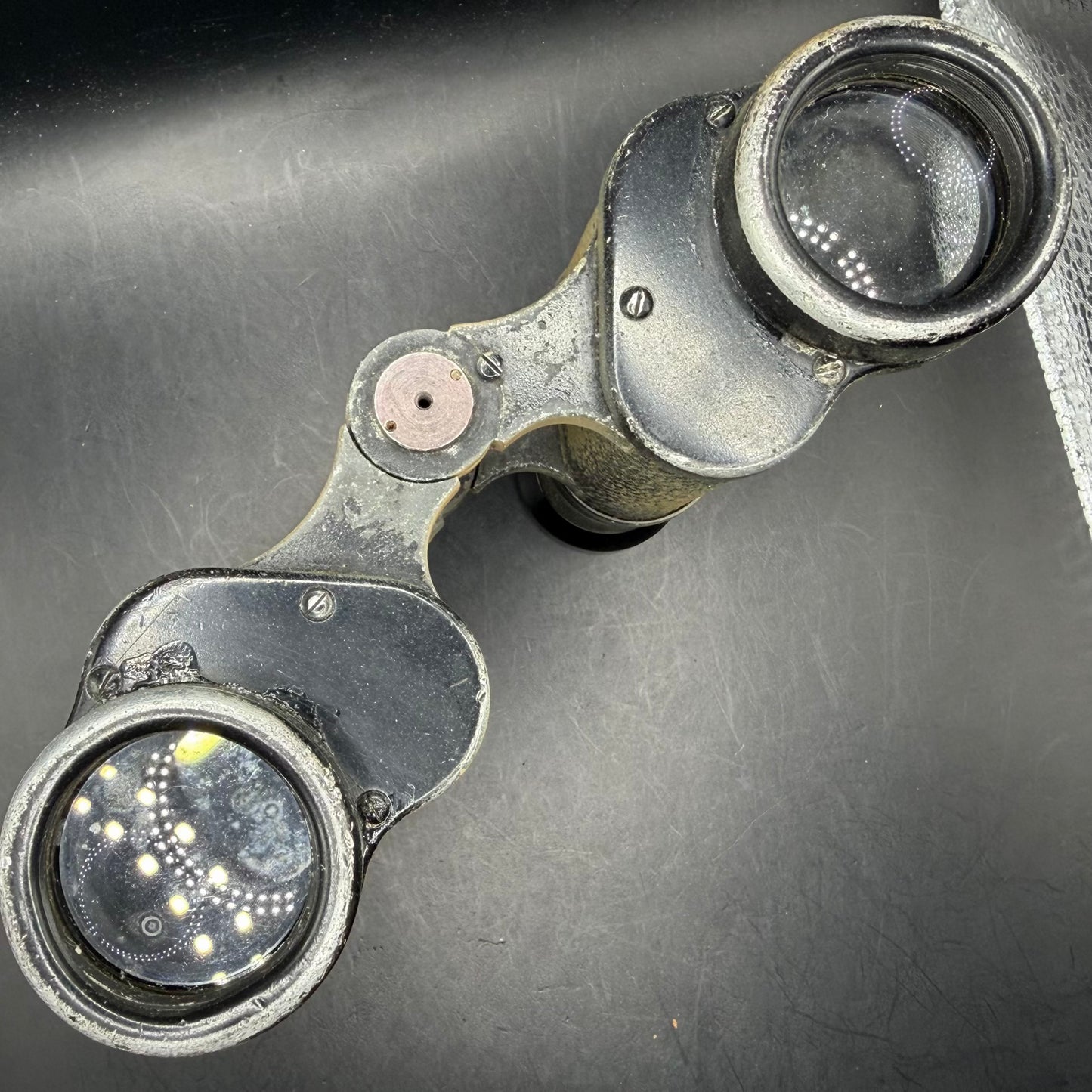 Objective lens view of original WWII German Dienstglas 6×30 binoculars, showing intact lenses and original housing.