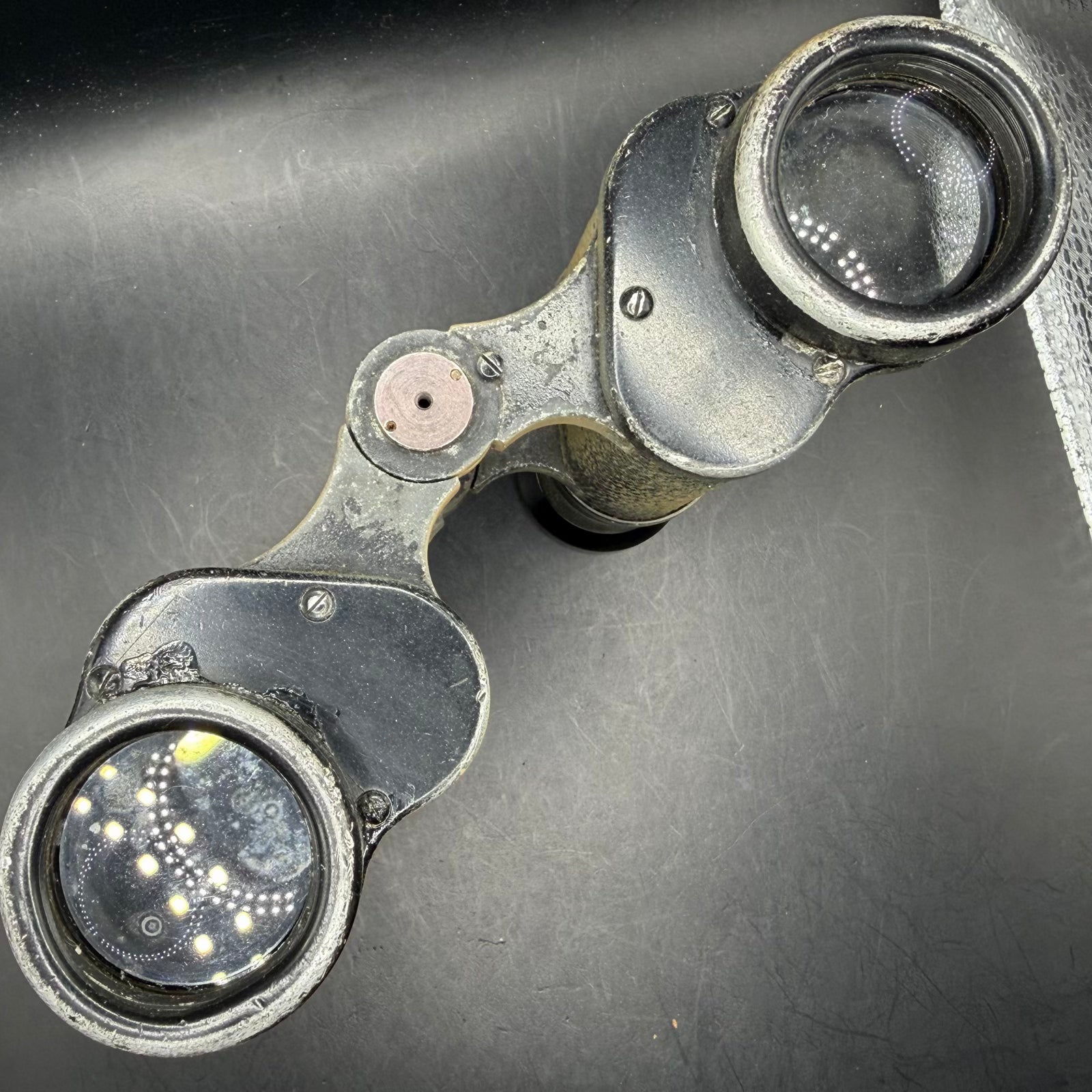 Objective lens view of original WWII German Dienstglas 6×30 binoculars, showing intact lenses and original housing.