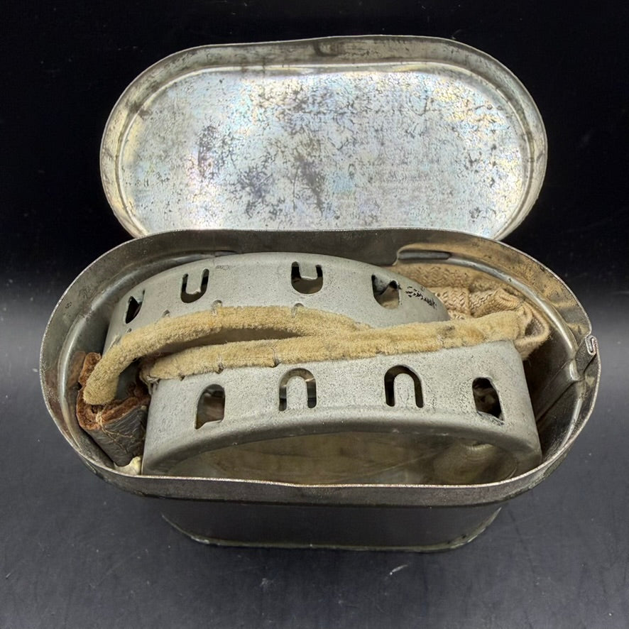 Interior view of original tin containing WWII British goggles