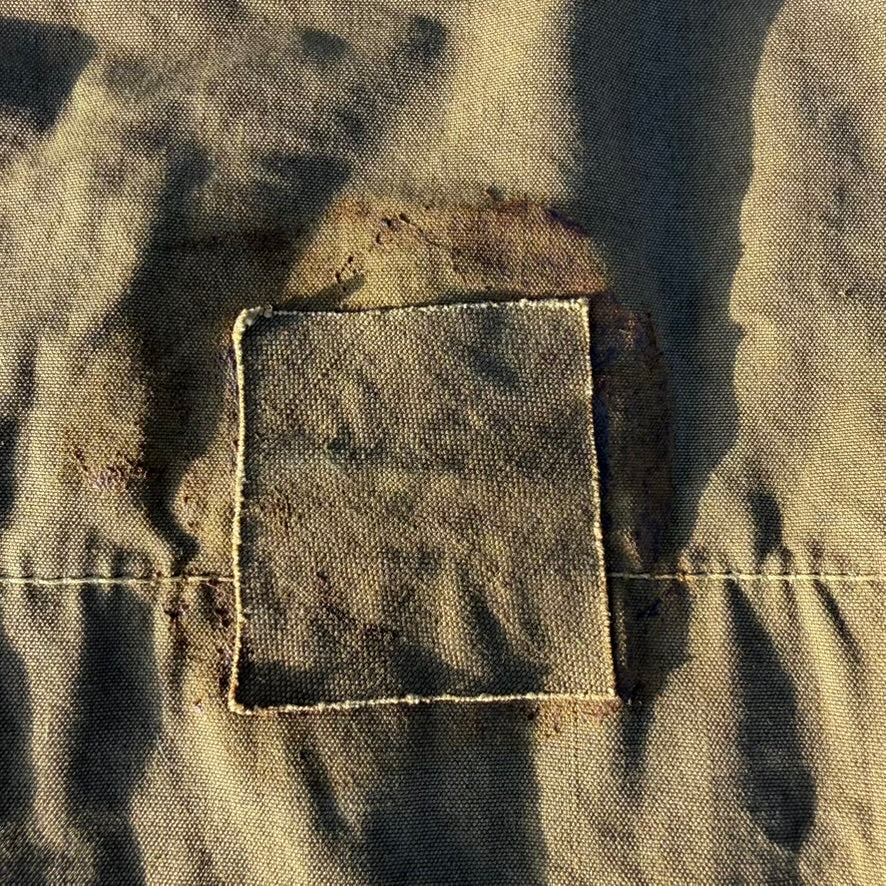 Original tie strap and stitching on WW2 German Zeltbahn, period correct construction