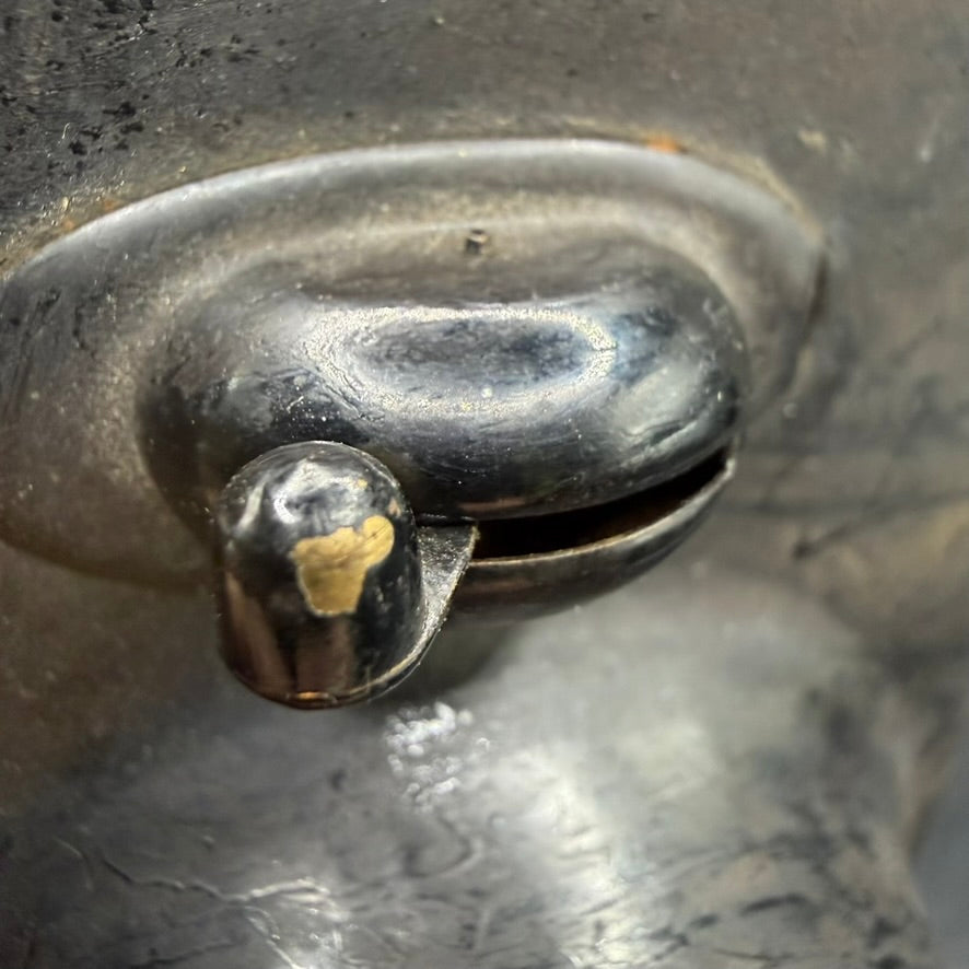 Detail of top-mounted slide switch on WWII German technical service lamp