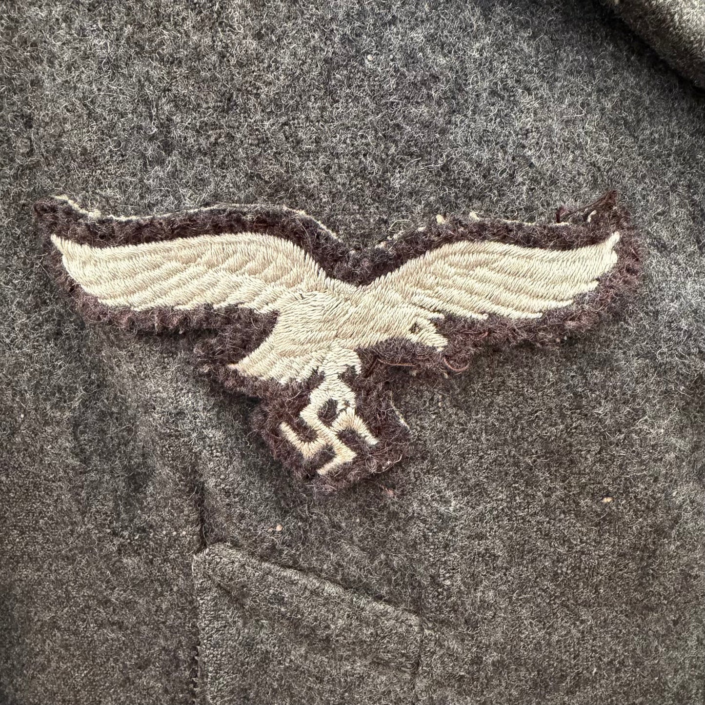 Original embroidered Luftwaffe breast eagle on private purchase WWII German coat
