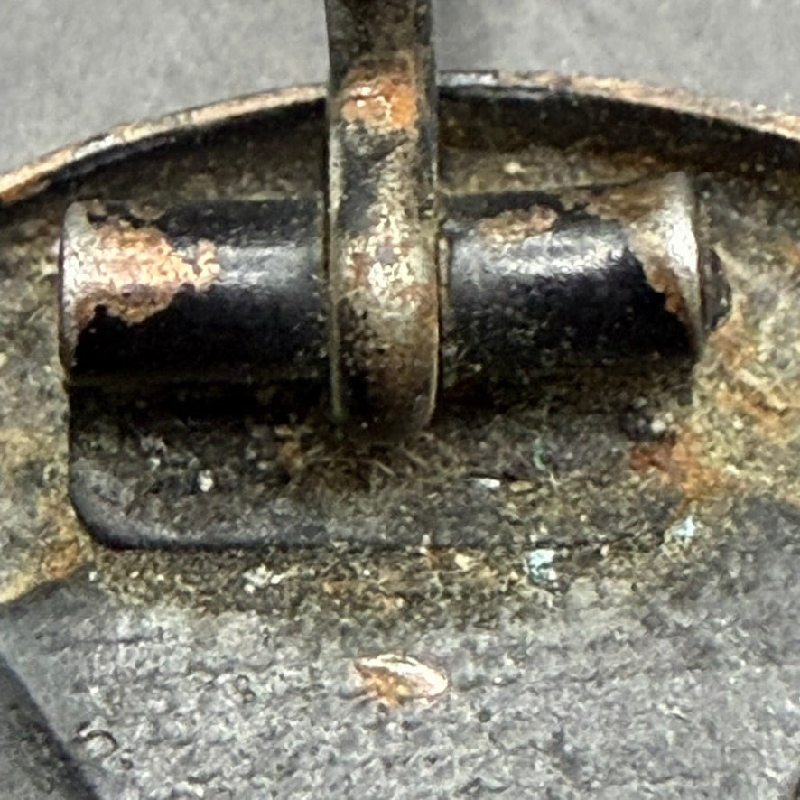 Close-up of sharp iron pin on WWII German zinc Wound Badge, original wartime construction