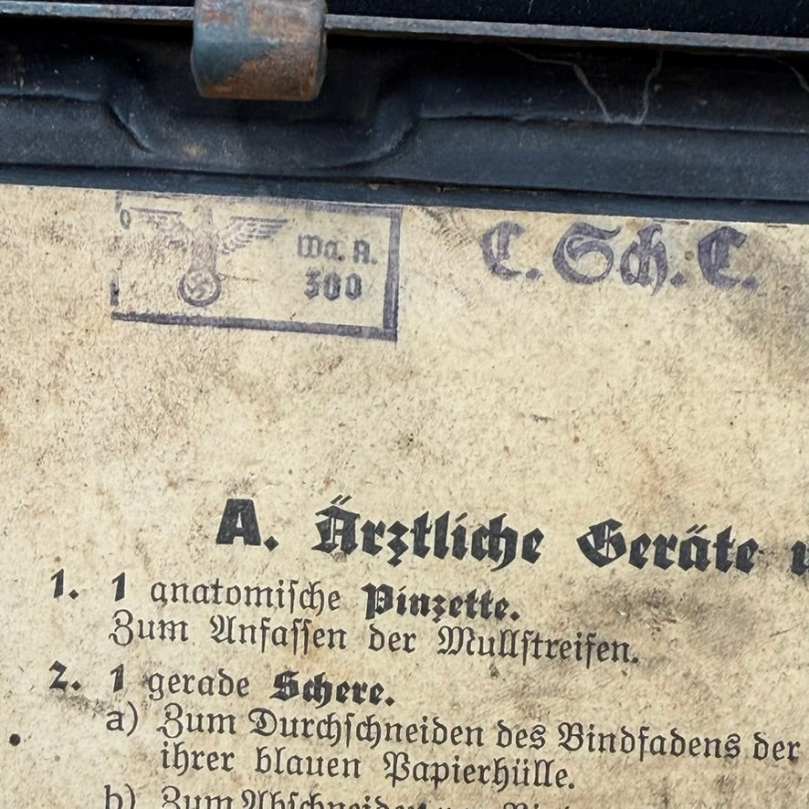 Close-up of swastika German medical instruction label inside first aid box