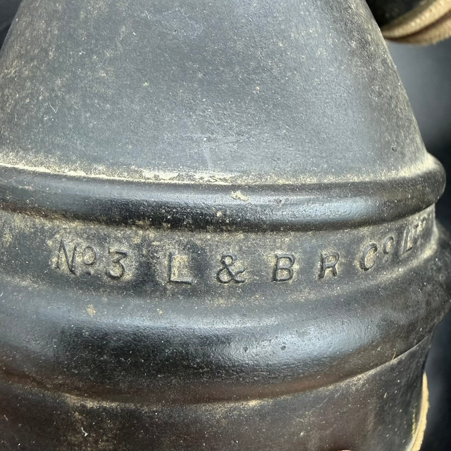 Close up rubber breathing hose and respirator unit of WWII British Hospital Respirator gas mask