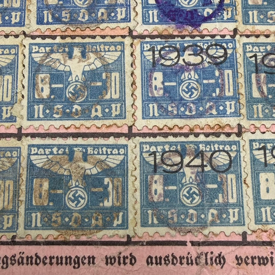 Close-up of multiple original NSDAP contribution stamps on reverse of German WWII party card