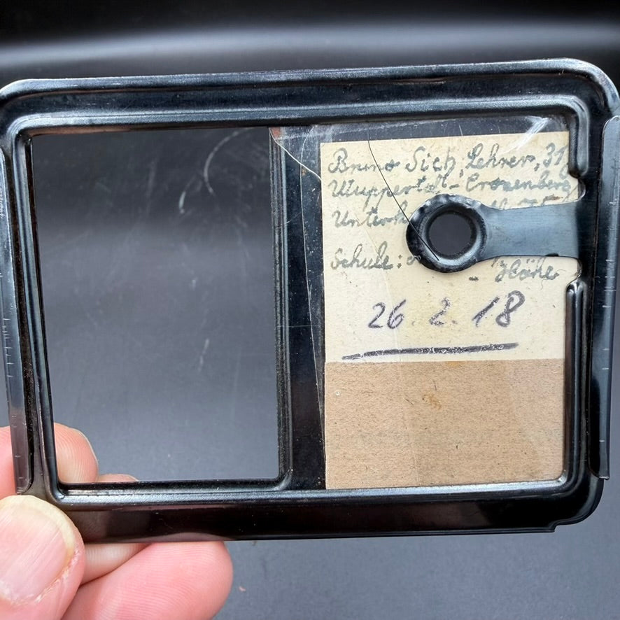 Original portrait photograph of Bruno Sich in metal Auslandpatent frame back side