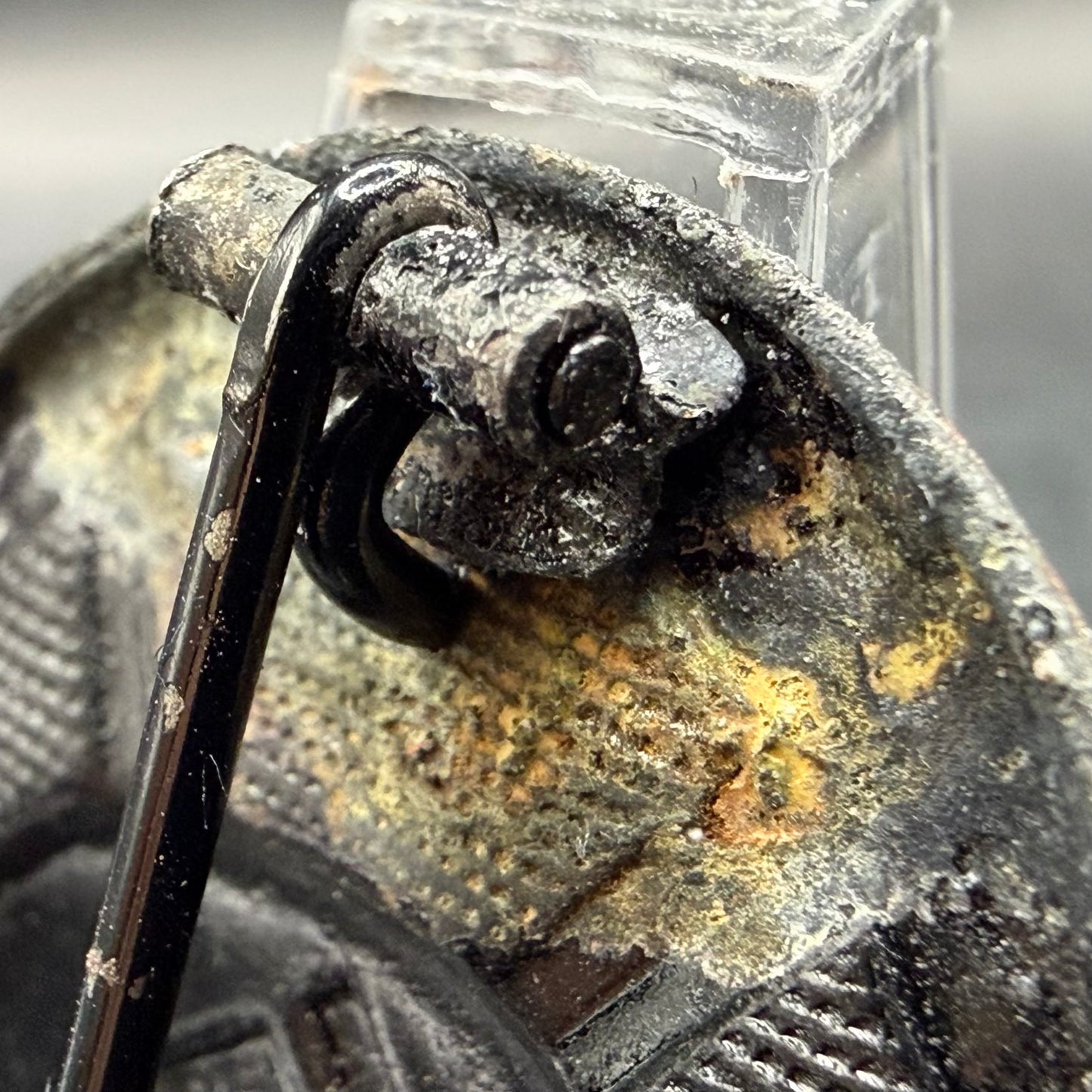 Close-up of wrap-around oval sheet metal hinge