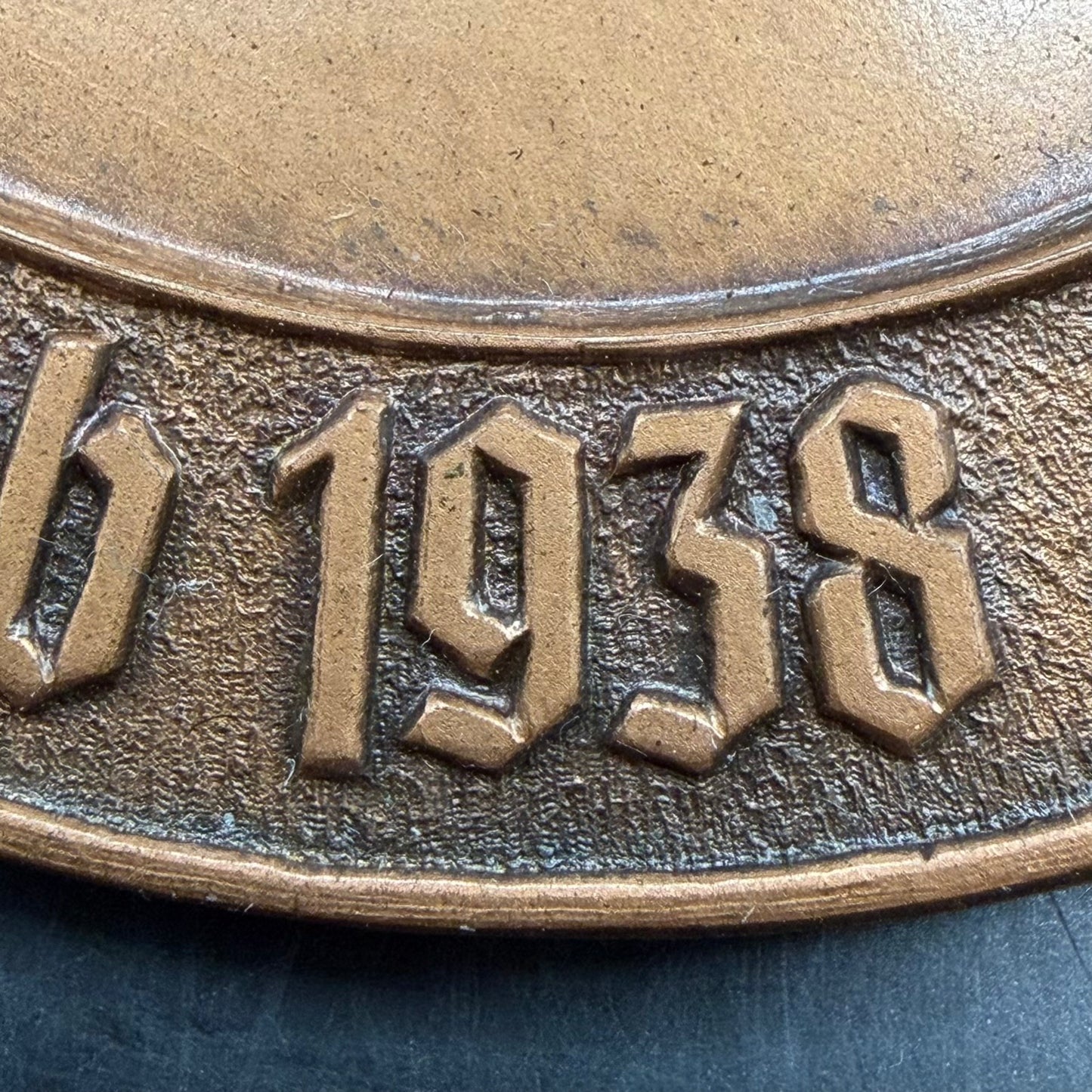 Close-up of NSFK winged figure emblem on 1938 bronze gliding medal